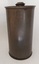 A tall vintage brown metal canister with a well-fitted lift off lid. It has a metal knob on top of the lid.