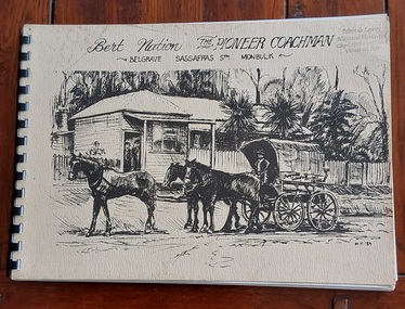 A cream rectangular paperback history book bound at the spine with spiral black plastic. The cover has an illustration of a horsedrawn coach on a dirt road.