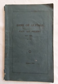 A thin blue paperback book titled The Shire of Lilydale: 1837 - 1923, which is printed in black lettering on the front cover.