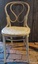 Four vintage cream painted Luterma bentwood kitchen chairs with traditional curly shaped backs with curved supports at the sides.