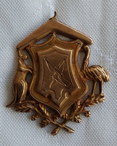 An antique Australian WW1 Commemorative 9c. rose gold fob medallion, engraved on the reverse for whom and when it was presented. 