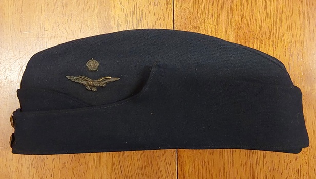 A navy blue woolen WW11 Officer's Forage Cap with shaped folded sides. 