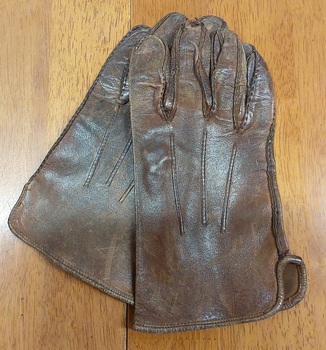 A pair of brown leather, RAF Officer's Dress gloves with three detailed stitching lines on the back of each glove.