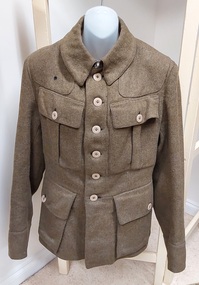 An Australian WWII four-pocket longer khaki wool serge service dress tunic, or military coat. 