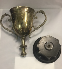 The silver portion of the trophy has separated from the Bakelite base and cannot be put back together