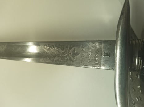Detail view of base of blade showing makers mark