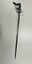 Full side view of sword, showing blade, hilt and knot