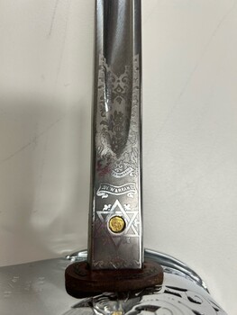detail photo of blade meeting hilt showing makers warrent 