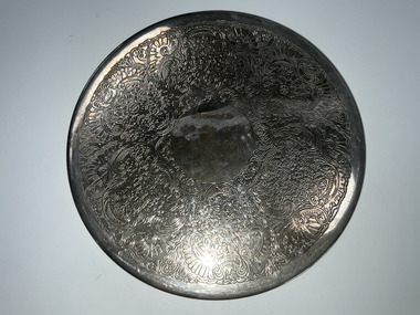 Domestic object - Silver place mat  JR Christie
