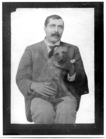 Photograph of Dr. Philip H. Donovan with dog, Dr. Philip H. Donovan with dog, circa 1895 to 1908