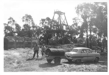 Photograph: People with dog and car near poppethead and boiler