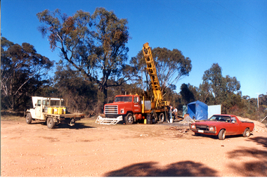 Photograph: Utes and drill at mine site