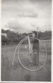 Photograph of Claude James and his penny-farthing bicycle