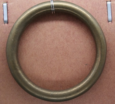 Brass ring used as equine accessory