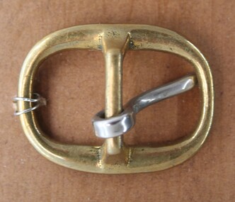 Brass buckle used as equine accessory