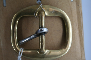 Brass sledge buckle with steel tongue used on horse accessories