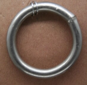 Nickel plated steel ring used in the construction of horse reins.