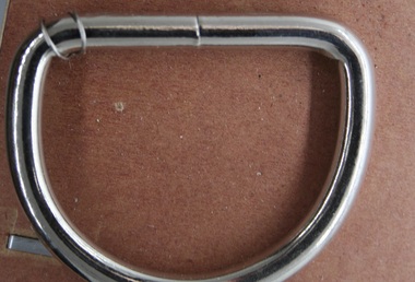 Nickle plated steel "D" ring as used on equine girth strap