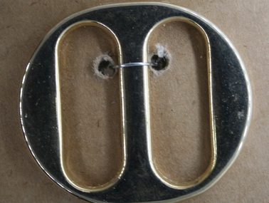 Brass body buckle used in equine strapping during late 19th and early 20th centuries