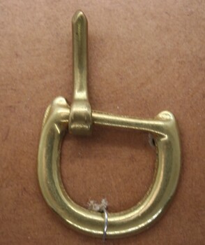 Horse shoe shaped half buckle used on equine accessories