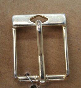Brass half buckle used as an equine  accessory
