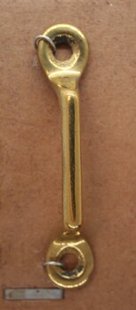 Item used and sold by Holden and Frost to be attatched to a solid object to guide straps, such as reins