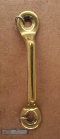 Item used and sold by Holden and Frost to be attatched to a solid object to guide straps, such as reins
