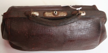 Small brown leather satchel for carrying smaller personal items