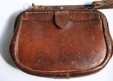 Shoulder carried leather cash bag manufactured by Holden and Frost