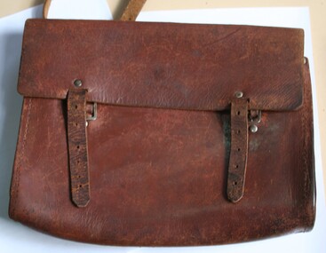 Brown leather shoulder hung school bag manufactured by Holden and Frost