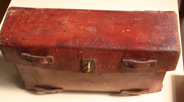 Postman's leather bag with brass ring manufactured and sold by Holden and Frost