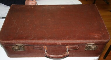 Leather suit case used by overland travellers  for carrying personal clothing and other objects manufactured by Holden and Frost