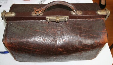 Leather and steel Gladstone bag used by professional persons to carry documents and so on, manufactured by Holden and Frost
