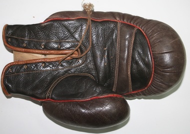Pair of leather boxing gloves made and sold by Holden and Frost