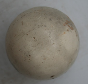 Round white equestrian polo ball imported by Holden and Frost