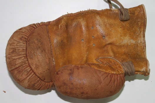 Brown leather boxing gloves as imported and sold by Holden and Frost