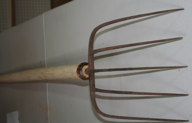 wooden handled five pronged steel pitch fork retailed by Holden and Frost