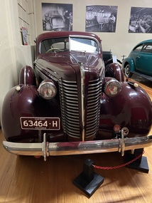 1938 burgundy body with white wheels