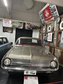 Holden HD Premier four door sedan, finished in a metallic grey with contrasting red upholstery. This model was noted for its "futuristic" design.