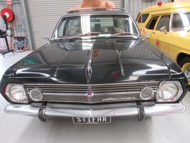 Black HR Holden car used as a hearse