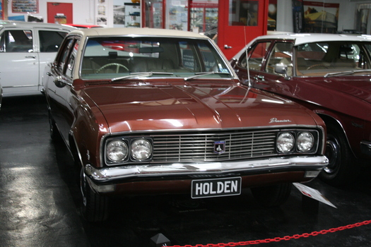 4 Door Premier sedan. Four headlights, brown colour with beige vinyl roof