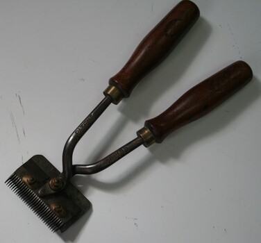 Steel equine horse clippers with wooden handles used for grooming horses