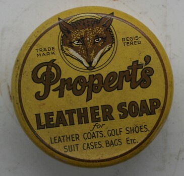 Round tin with yellow lid with instructions and trade mark