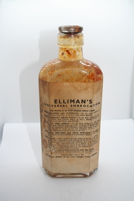 Glass Jar containing Elliman's Embrocation liquid, multi purpose medication , for treating colds, bruises  and strains.