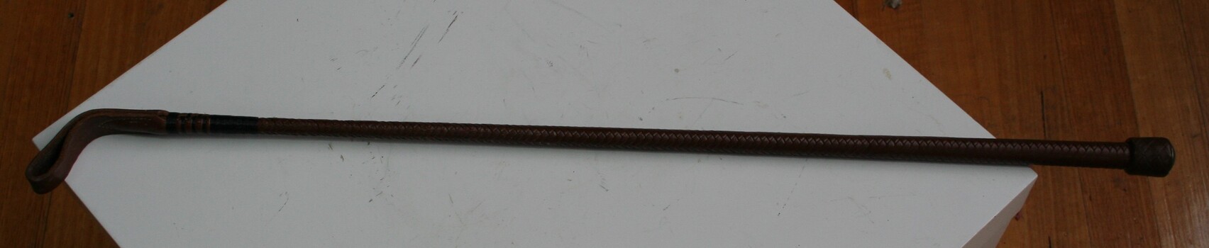 Equestrian crop used by riders to encourage their mounts forward.