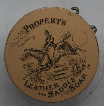 round squat tin can with instructions printed on outer 
