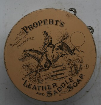 Squat round tin, with instructions printed on outer