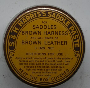 Round squat tin wirh yellow painted press lid. Instructions for use printed on lid