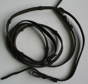 Two leather straps joined to make a rein