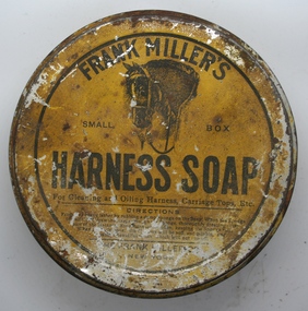 Squat round tin containing a paste of Harness soap